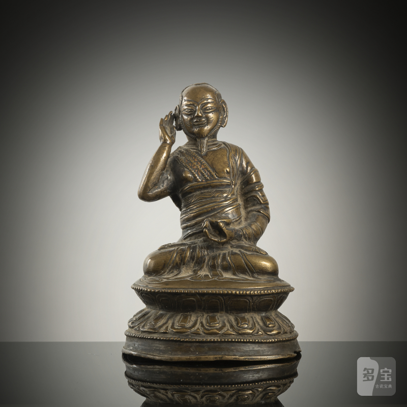 A BRONZE FIGURE OF A LAMA, POSSIBLY MILAREPA